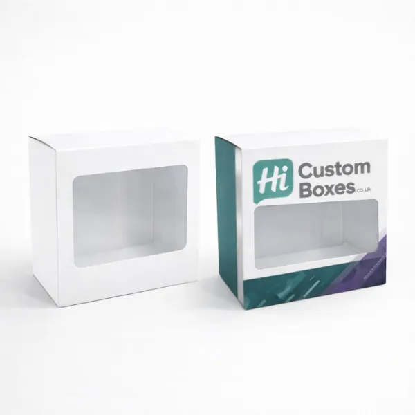 Two square white boxes with clear front windows- showing one plain and one with branding- class=